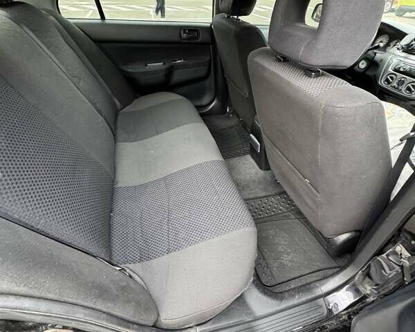 Чорний Міцубісі Lancer, об'ємом двигуна 1.6 л та пробігом 245 тис. км за 4500 $, фото 18 на Automoto.ua