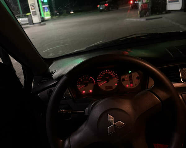 Черный Мицубиси Лансер, объемом двигателя 1.58 л и пробегом 230 тыс. км за 4300 $, фото 24 на Automoto.ua