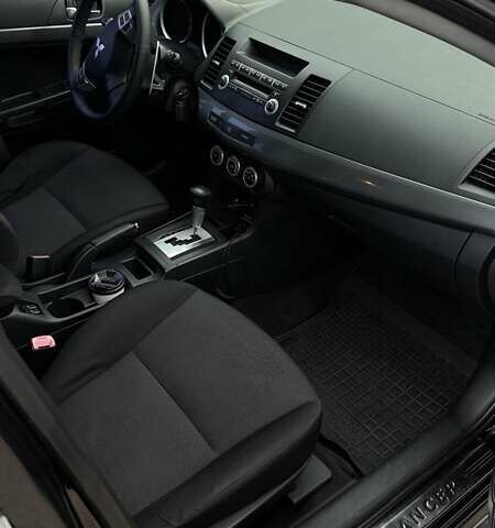 Черный Мицубиси Лансер, объемом двигателя 2 л и пробегом 222 тыс. км за 6000 $, фото 7 на Automoto.ua