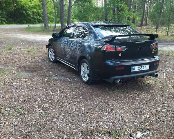 Чорний Міцубісі Lancer, об'ємом двигуна 2 л та пробігом 150 тис. км за 7600 $, фото 11 на Automoto.ua