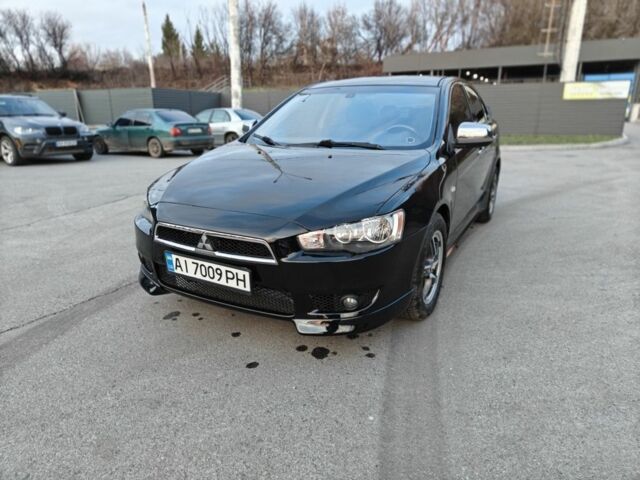 Черный Мицубиси Лансер, объемом двигателя 2 л и пробегом 245 тыс. км за 5600 $, фото 4 на Automoto.ua