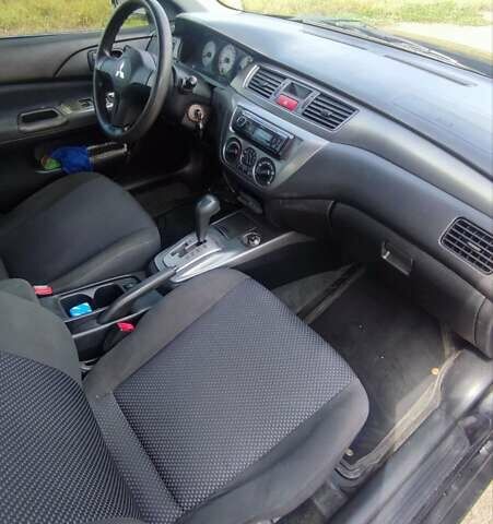 Черный Мицубиси Лансер, объемом двигателя 1.6 л и пробегом 243 тыс. км за 4500 $, фото 14 на Automoto.ua