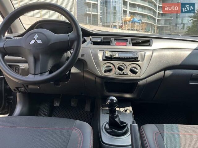 Чорний Міцубісі Lancer, об'ємом двигуна 1.6 л та пробігом 296 тис. км за 4200 $, фото 35 на Automoto.ua