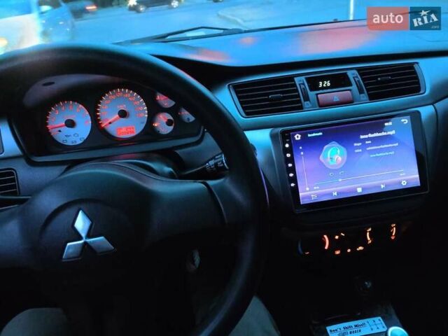 Мицубиси Лансер 2008 в Львове на Automoto.ua Черный Мицубиси Лансер, объемом двигателя 1.58 л и пробегом 200 тыс. км за 5200 $, фото 108 на Automoto.ua