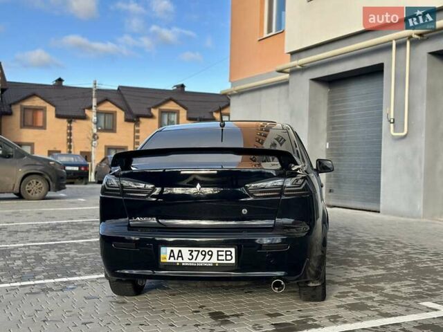 Черный Мицубиси Лансер, объемом двигателя 2 л и пробегом 150 тыс. км за 7850 $, фото 21 на Automoto.ua