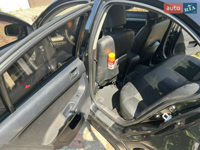 Чорний Міцубісі Lancer, об'ємом двигуна 1.5 л та пробігом 201 тис. км за 7000 $, фото 5 на Automoto.ua