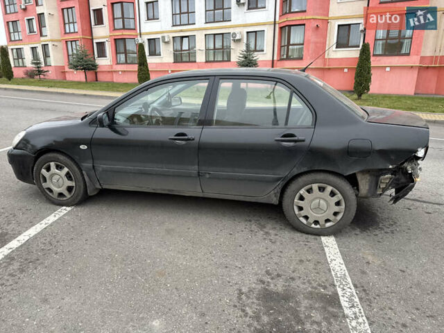 Чорний Міцубісі Lancer, об'ємом двигуна 1.58 л та пробігом 388 тис. км за 2300 $, фото 7 на Automoto.ua