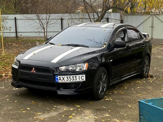 Черный Мицубиси Лансер, объемом двигателя 2 л и пробегом 160 тыс. км за 8000 $, фото 5 на Automoto.ua
