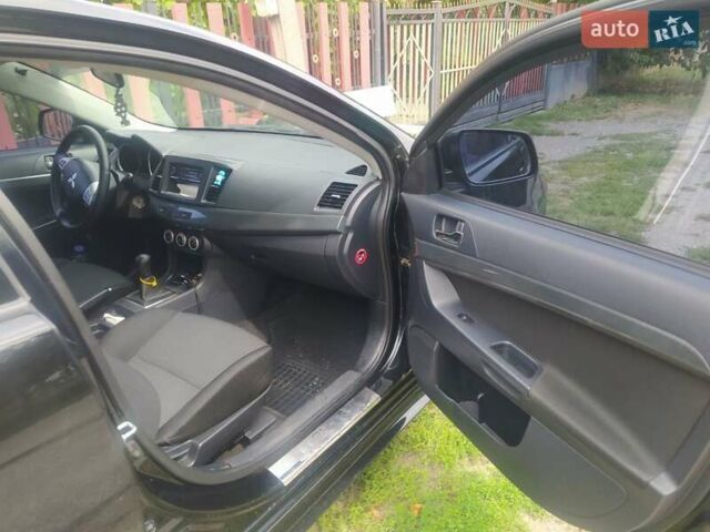 Чорний Міцубісі Lancer, об'ємом двигуна 2 л та пробігом 183 тис. км за 5000 $, фото 11 на Automoto.ua