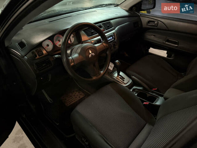 Чорний Міцубісі Lancer, об'ємом двигуна 1.58 л та пробігом 212 тис. км за 5500 $, фото 6 на Automoto.ua