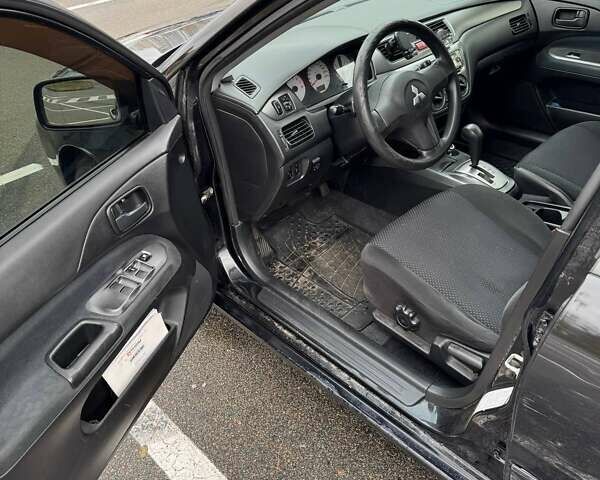 Чорний Міцубісі Lancer, об'ємом двигуна 1.6 л та пробігом 245 тис. км за 4500 $, фото 13 на Automoto.ua