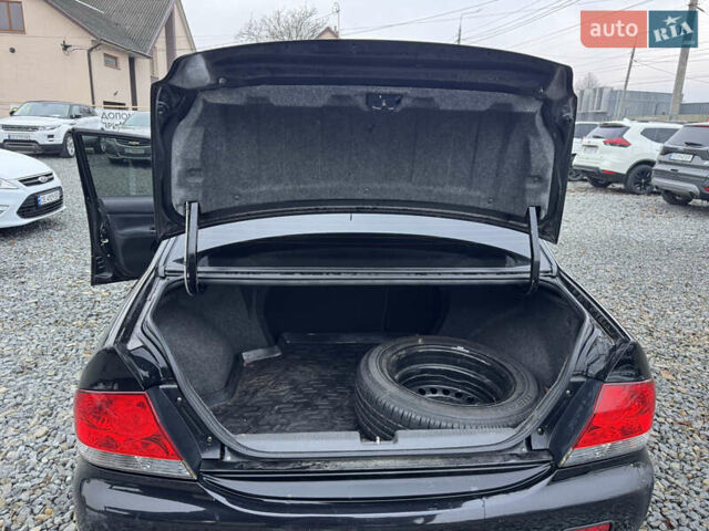 Черный Мицубиси Лансер, объемом двигателя 1.58 л и пробегом 202 тыс. км за 4100 $, фото 28 на Automoto.ua