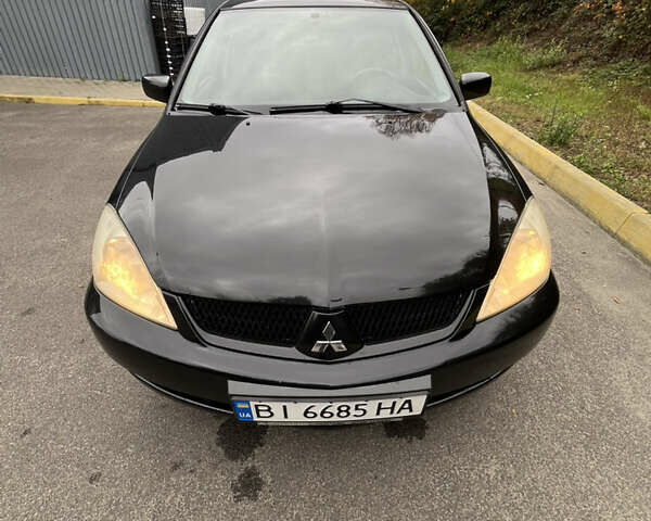 Чорний Міцубісі Lancer, об'ємом двигуна 1.58 л та пробігом 192 тис. км за 4500 $, фото 10 на Automoto.ua