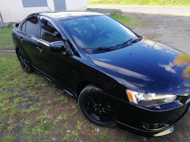 Міцубісі Lancer 2008 у Києві на Automoto.ua Чорний Міцубісі Lancer, об'ємом двигуна 2 л та пробігом 196 тис. км за 5500 $, фото 8 на Automoto.ua
