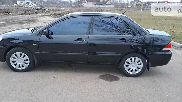 Чорний Міцубісі Lancer, об'ємом двигуна 1.6 л та пробігом 131 тис. км за 6000 $, фото 6 на Automoto.ua