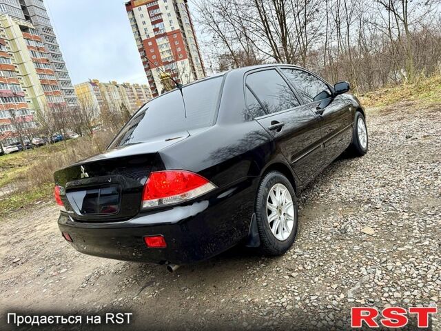 Черный Мицубиси Лансер, объемом двигателя 1.6 л и пробегом 216 тыс. км за 5190 $, фото 4 на Automoto.ua