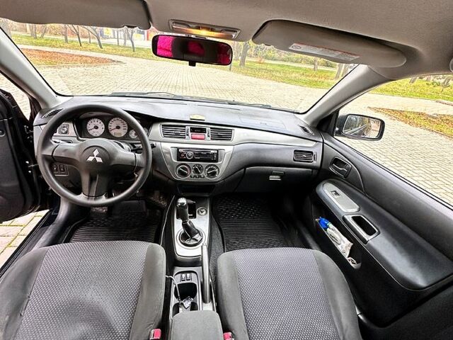 Черный Мицубиси Лансер, объемом двигателя 1.6 л и пробегом 185 тыс. км за 5500 $, фото 7 на Automoto.ua