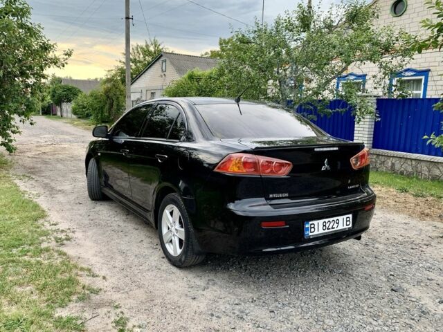 Чорний Міцубісі Lancer, об'ємом двигуна 2 л та пробігом 242 тис. км за 7000 $, фото 6 на Automoto.ua