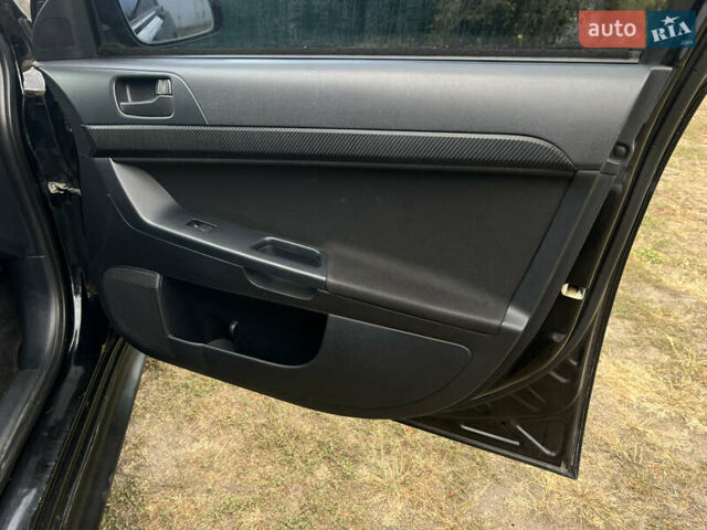 Чорний Міцубісі Lancer, об'ємом двигуна 1.5 л та пробігом 223 тис. км за 5699 $, фото 23 на Automoto.ua