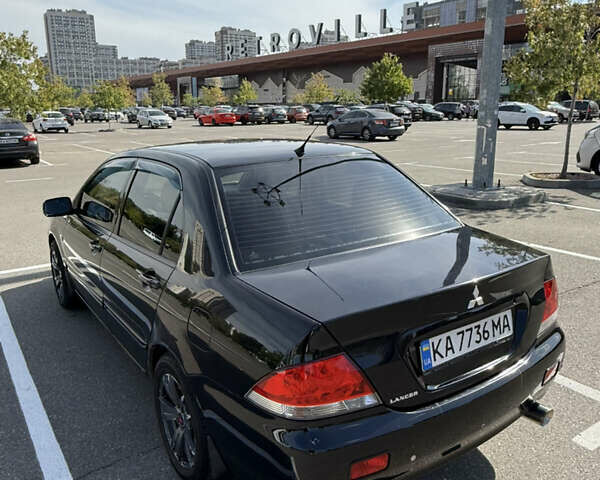 Черный Мицубиси Лансер, объемом двигателя 1.6 л и пробегом 321 тыс. км за 5000 $, фото 7 на Automoto.ua