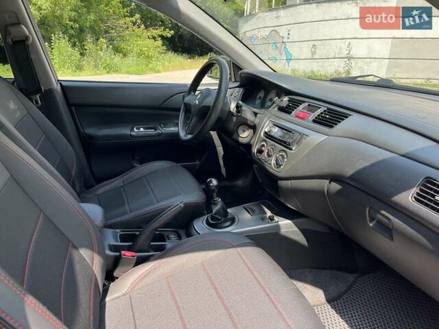 Чорний Міцубісі Lancer, об'ємом двигуна 1.6 л та пробігом 296 тис. км за 4200 $, фото 45 на Automoto.ua