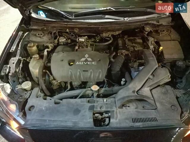 Черный Мицубиси Лансер, объемом двигателя 2 л и пробегом 240 тыс. км за 6400 $, фото 21 на Automoto.ua