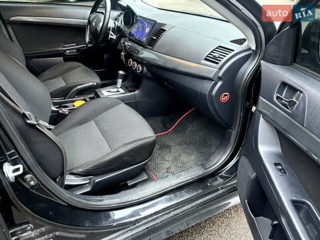 Черный Мицубиси Лансер, объемом двигателя 2 л и пробегом 217 тыс. км за 7000 $, фото 44 на Automoto.ua