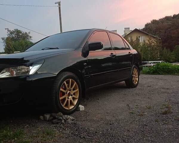 Мицубиси Лансер 2008 в Львове на Automoto.ua Черный Мицубиси Лансер, объемом двигателя 1.58 л и пробегом 200 тыс. км за 5200 $, фото 207 на Automoto.ua