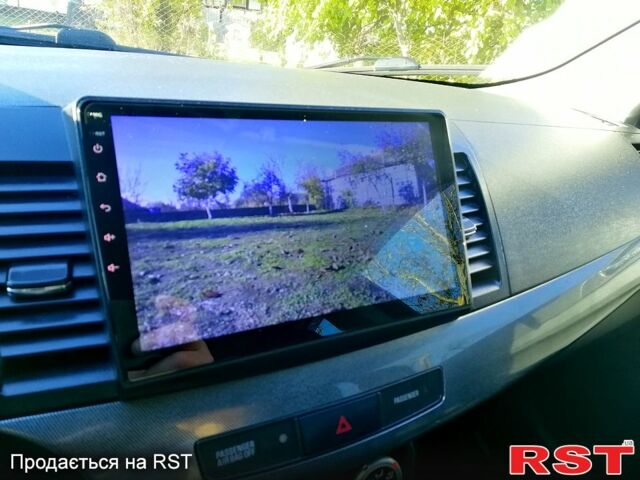 Черный Мицубиси Лансер, объемом двигателя 2 л и пробегом 196 тыс. км за 5500 $, фото 8 на Automoto.ua