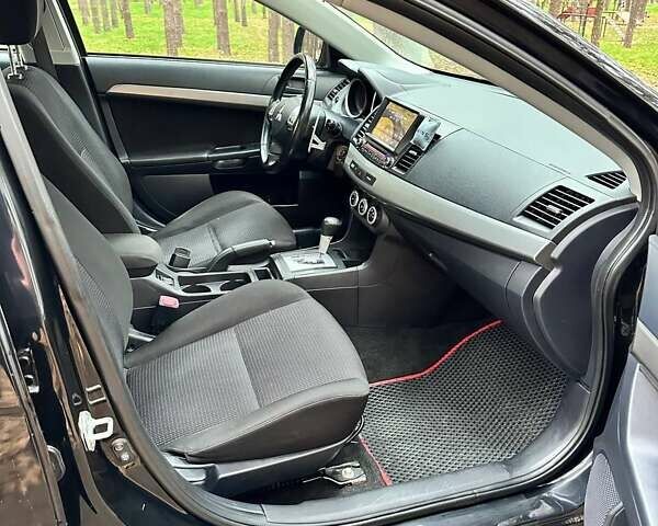 Черный Мицубиси Лансер, объемом двигателя 2 л и пробегом 216 тыс. км за 5600 $, фото 7 на Automoto.ua