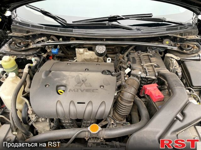 Черный Мицубиси Лансер, объемом двигателя 2 л и пробегом 226 тыс. км за 6600 $, фото 6 на Automoto.ua