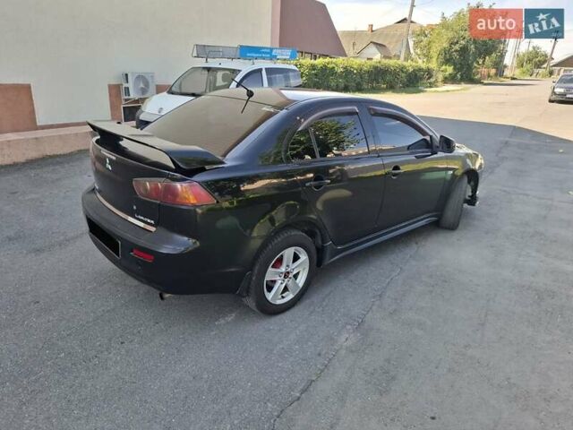 Черный Мицубиси Лансер, объемом двигателя 2 л и пробегом 230 тыс. км за 7000 $, фото 17 на Automoto.ua