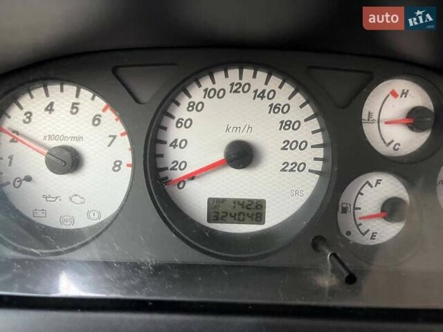 Чорний Міцубісі Lancer, об'ємом двигуна 1.6 л та пробігом 324 тис. км за 3800 $, фото 6 на Automoto.ua