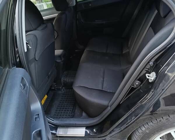 Черный Мицубиси Лансер, объемом двигателя 1.5 л и пробегом 167 тыс. км за 5500 $, фото 4 на Automoto.ua