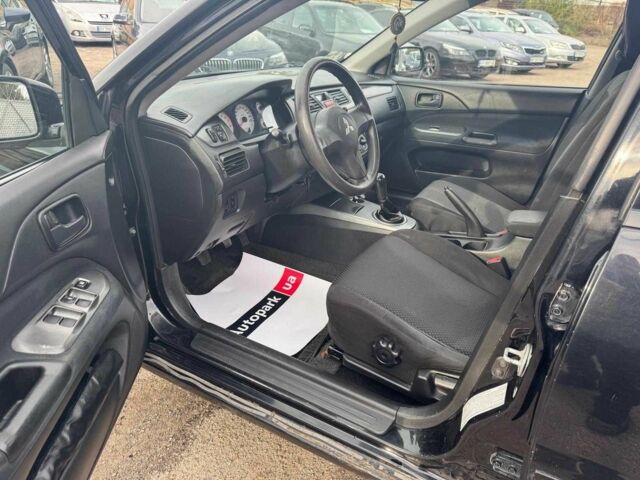 Мицубиси Лансер 2008 в Запорожье на Automoto.ua Черный Мицубиси Лансер, объемом двигателя 1.6 л и пробегом 316 тыс. км за 4290 $, фото 10 на Automoto.ua