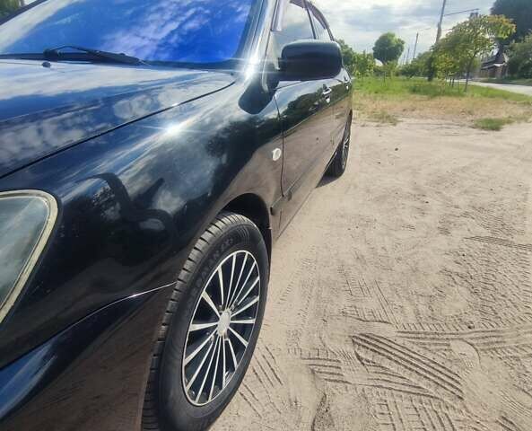 Чорний Міцубісі Lancer, об'ємом двигуна 0 л та пробігом 205 тис. км за 5250 $, фото 7 на Automoto.ua