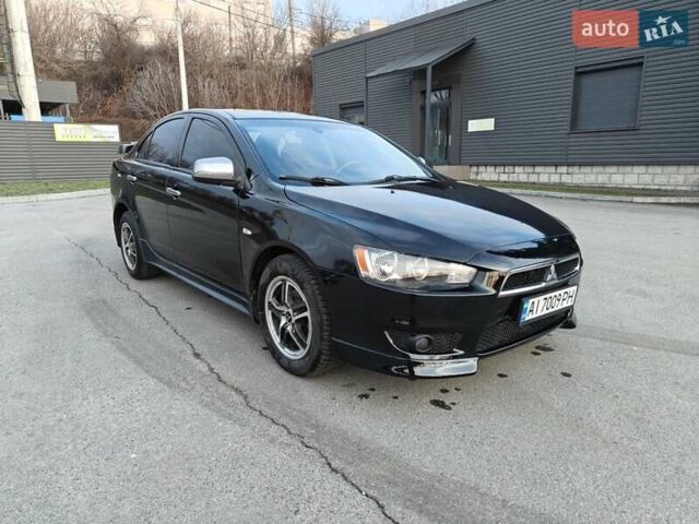 Черный Мицубиси Лансер, объемом двигателя 2 л и пробегом 245 тыс. км за 5600 $, фото 6 на Automoto.ua