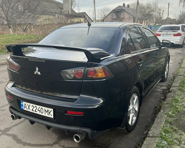 Черный Мицубиси Лансер, объемом двигателя 2 л и пробегом 270 тыс. км за 5400 $, фото 3 на Automoto.ua