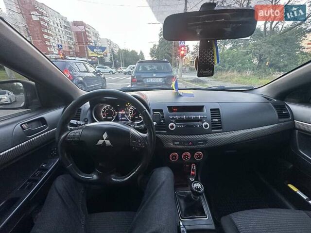 Черный Мицубиси Лансер, объемом двигателя 2 л и пробегом 188 тыс. км за 6900 $, фото 7 на Automoto.ua