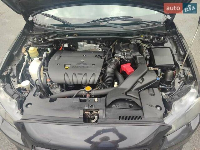 Черный Мицубиси Лансер, объемом двигателя 2 л и пробегом 229 тыс. км за 7300 $, фото 14 на Automoto.ua