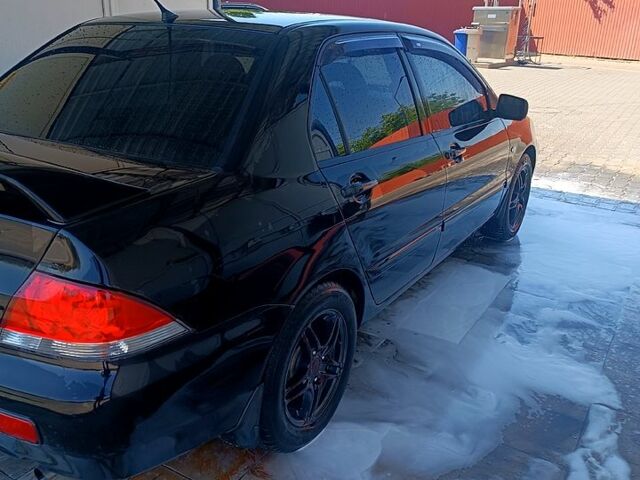 Чорний Міцубісі Lancer, об'ємом двигуна 1.6 л та пробігом 0 тис. км за 4200 $, фото 7 на Automoto.ua