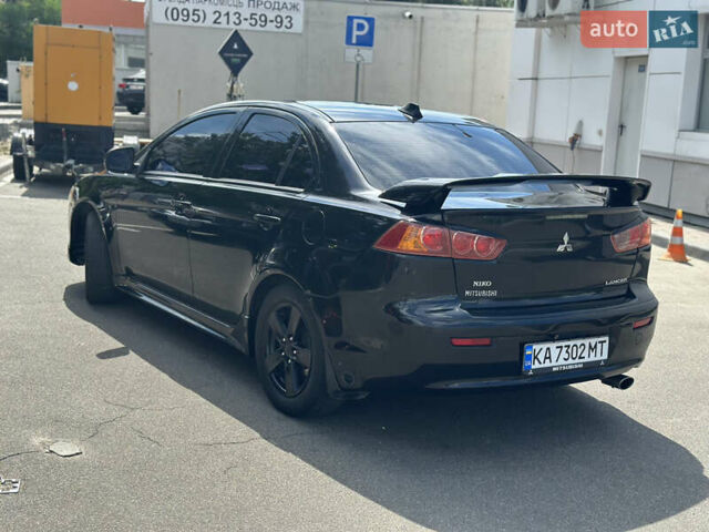Черный Мицубиси Лансер, объемом двигателя 2 л и пробегом 295 тыс. км за 7000 $, фото 5 на Automoto.ua