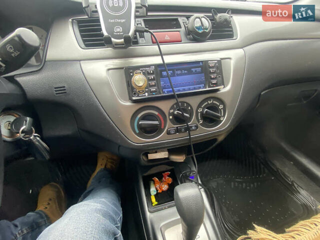 Черный Мицубиси Лансер, объемом двигателя 1.58 л и пробегом 211 тыс. км за 6333 $, фото 40 на Automoto.ua