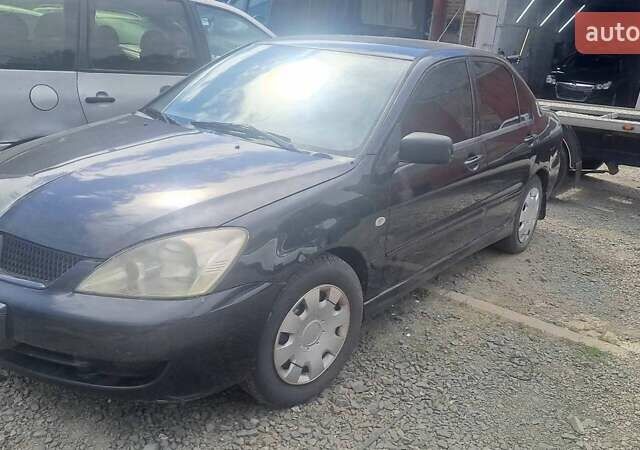 Черный Мицубиси Лансер, объемом двигателя 1.58 л и пробегом 316 тыс. км за 2200 $, фото 2 на Automoto.ua