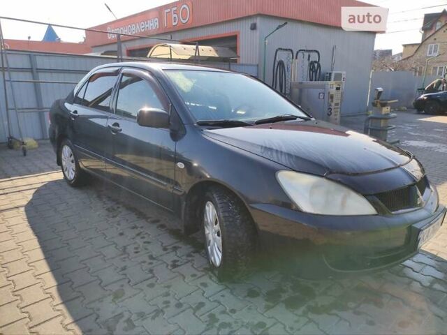 Чорний Міцубісі Lancer, об'ємом двигуна 1.6 л та пробігом 335 тис. км за 3100 $, фото 5 на Automoto.ua