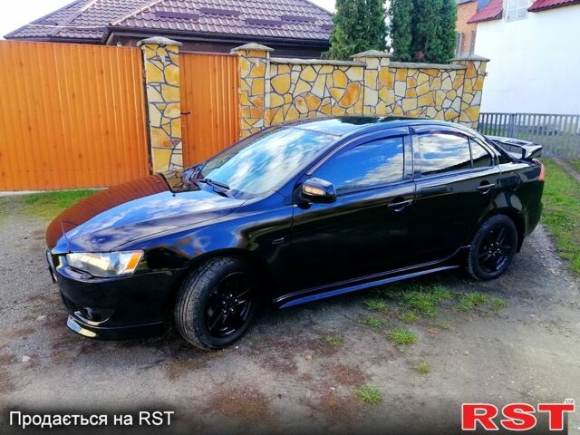 Черный Мицубиси Лансер, объемом двигателя 2 л и пробегом 196 тыс. км за 5500 $, фото 1 на Automoto.ua