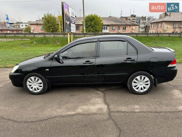Чорний Міцубісі Lancer, об'ємом двигуна 1.6 л та пробігом 200 тис. км за 4500 $, фото 7 на Automoto.ua