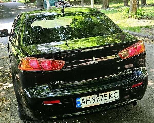 Черный Мицубиси Лансер, объемом двигателя 1.5 л и пробегом 205 тыс. км за 6300 $, фото 1 на Automoto.ua