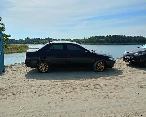 Мицубиси Лансер 2008 в Львове на Automoto.ua Черный Мицубиси Лансер, объемом двигателя 1.58 л и пробегом 200 тыс. км за 5200 $, фото 175 на Automoto.ua
