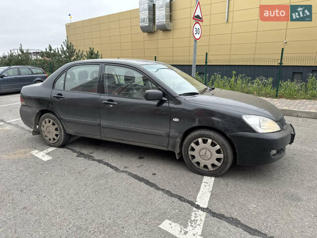 Чорний Міцубісі Lancer, об'ємом двигуна 1.58 л та пробігом 388 тис. км за 2300 $, фото 4 на Automoto.ua